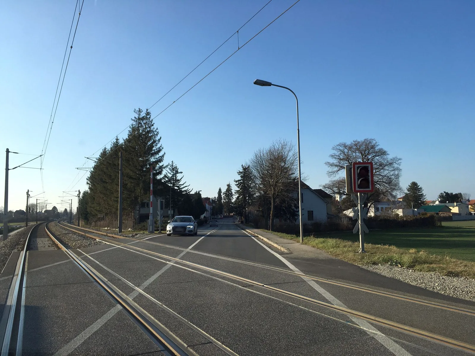 Street-level view of a level crossing in Austria