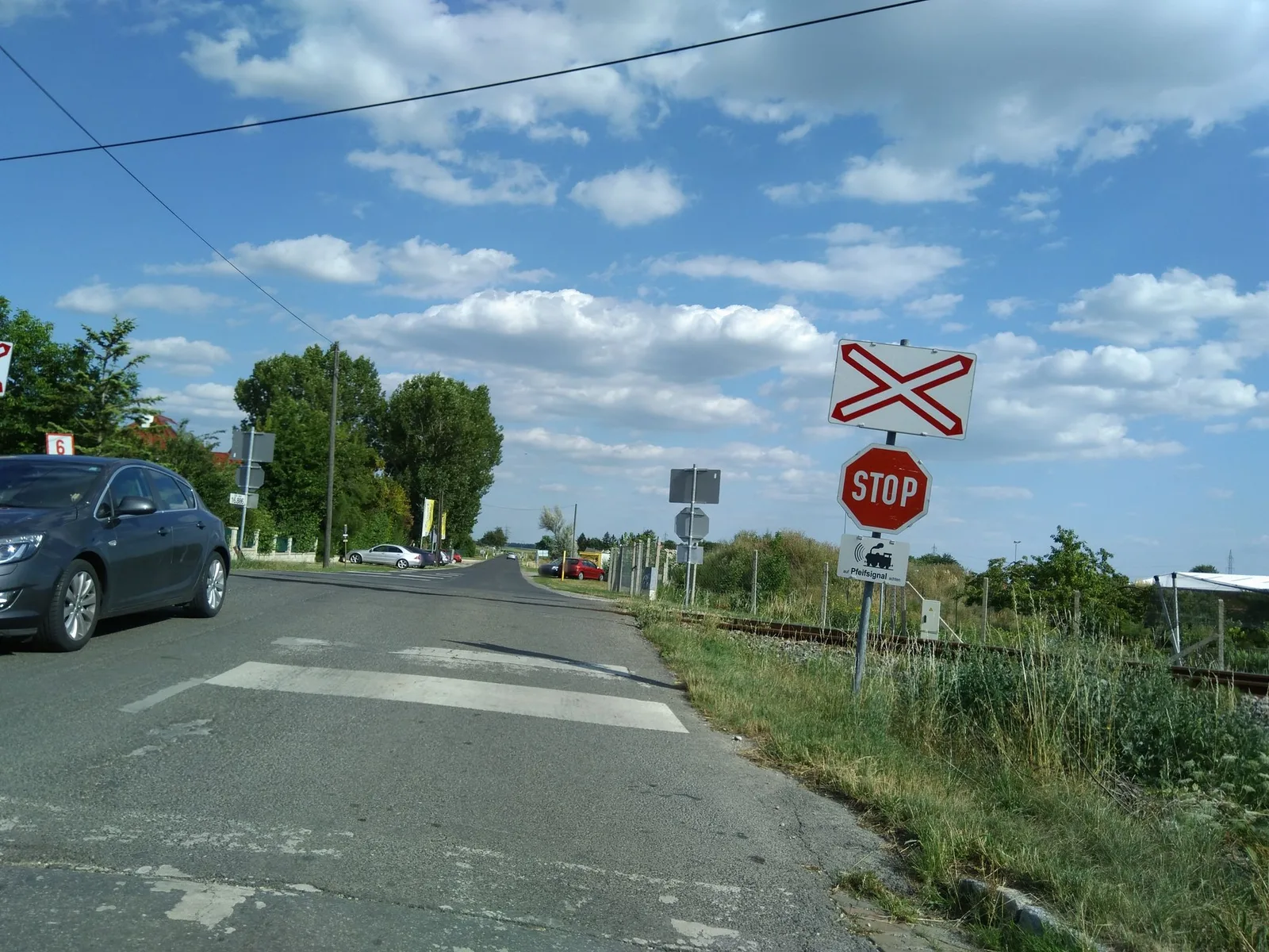 Street-level view of a level crossing in Austria