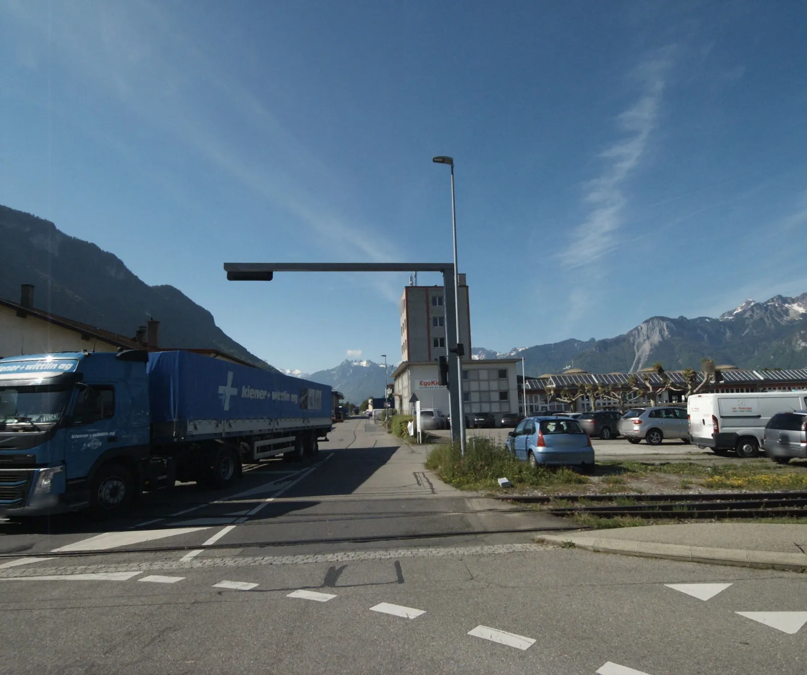 Street-level view of a level crossing in Switzerland