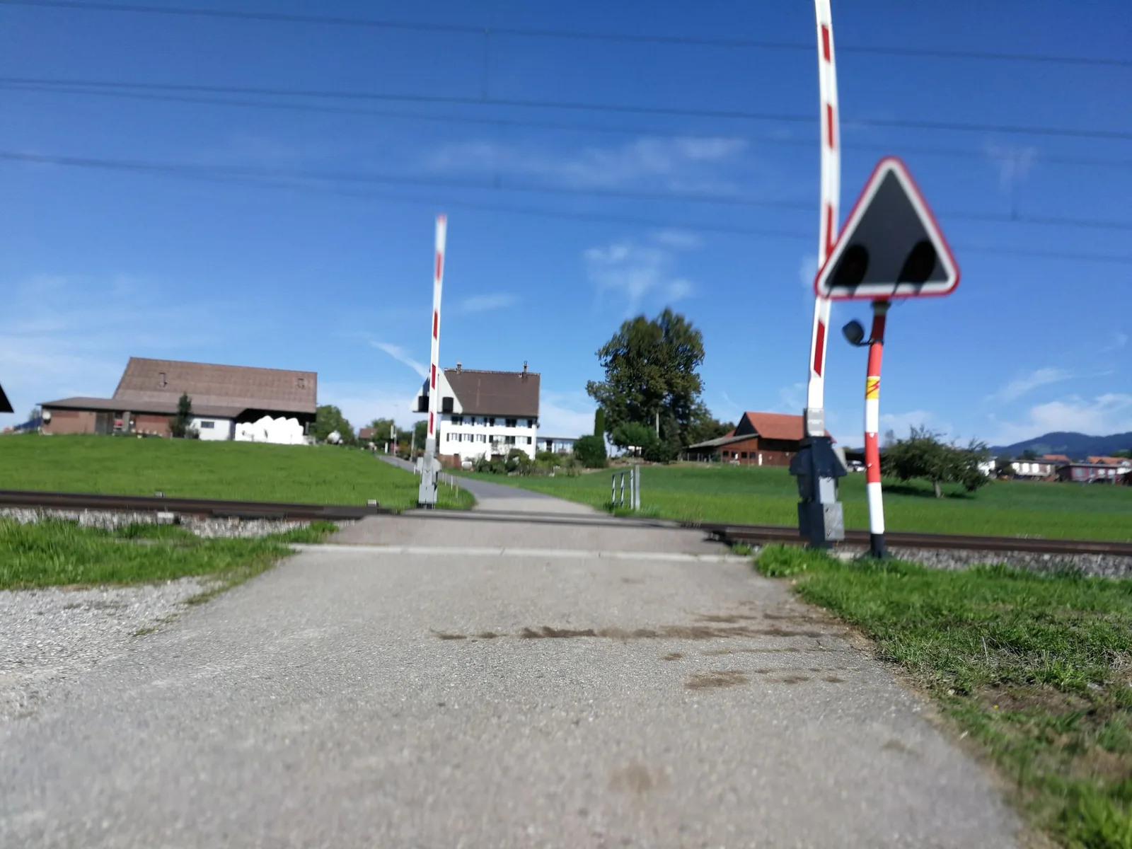 Street-level view of a level crossing in Switzerland