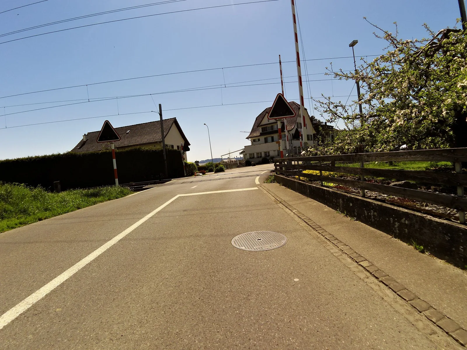 Street-level view of a level crossing in Switzerland