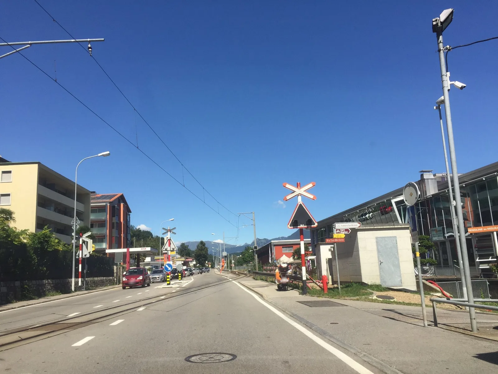 Street-level view of a level crossing in Switzerland