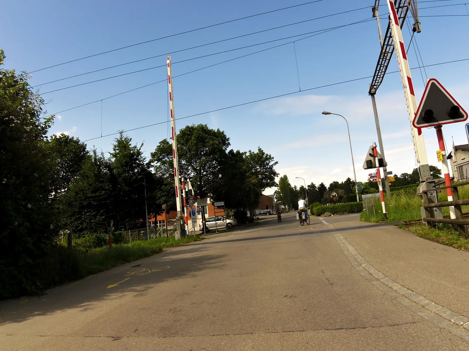 Street-level view of a level crossing in Switzerland