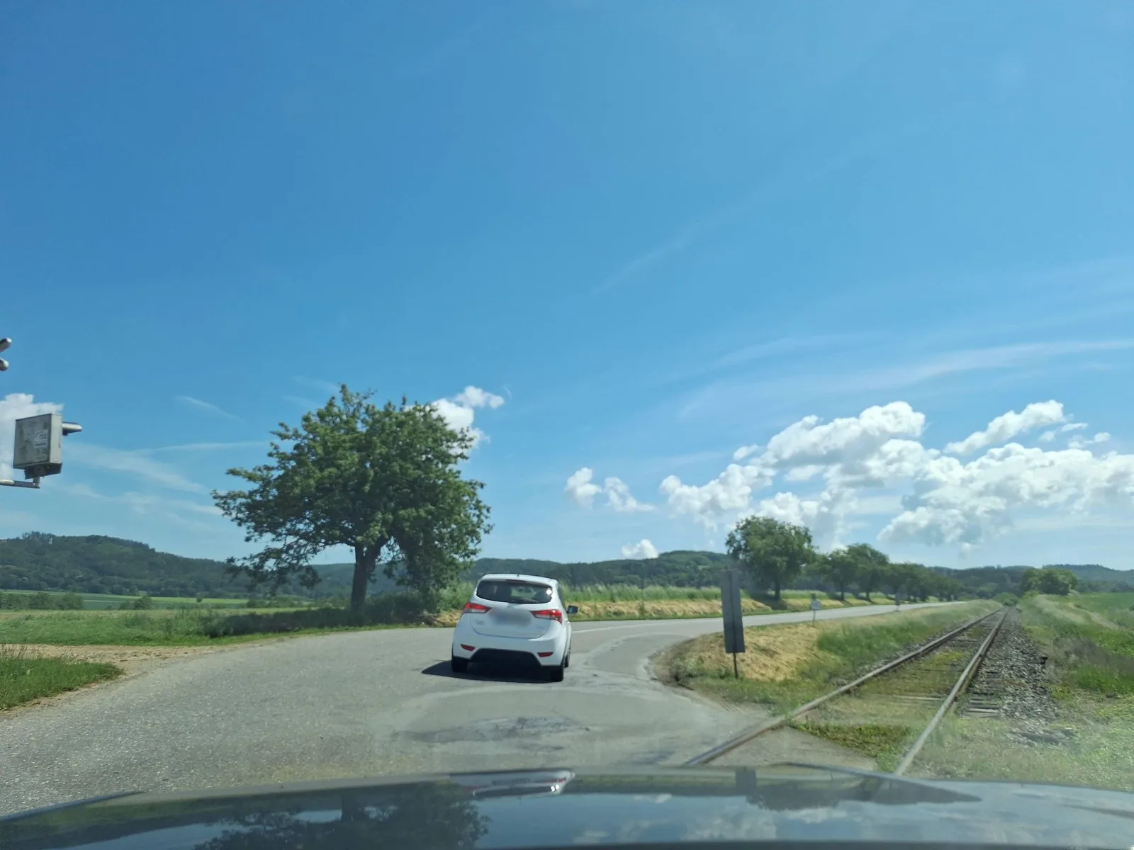 Street-level view of a level crossing in the Czech Republic