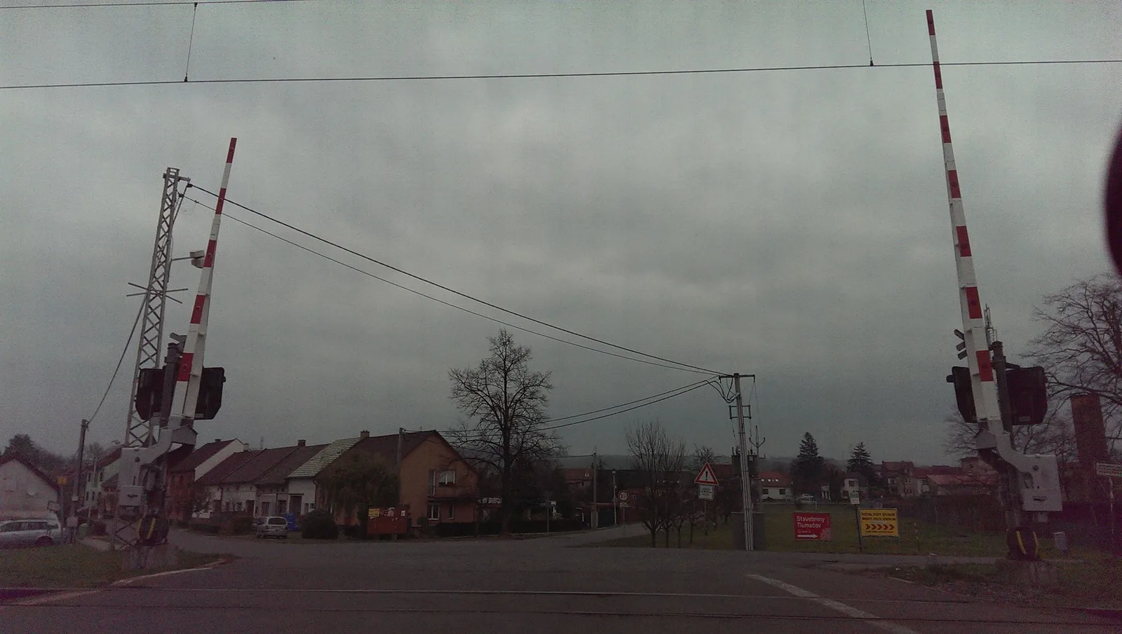 Street-level view of a level crossing in the Czech Republic