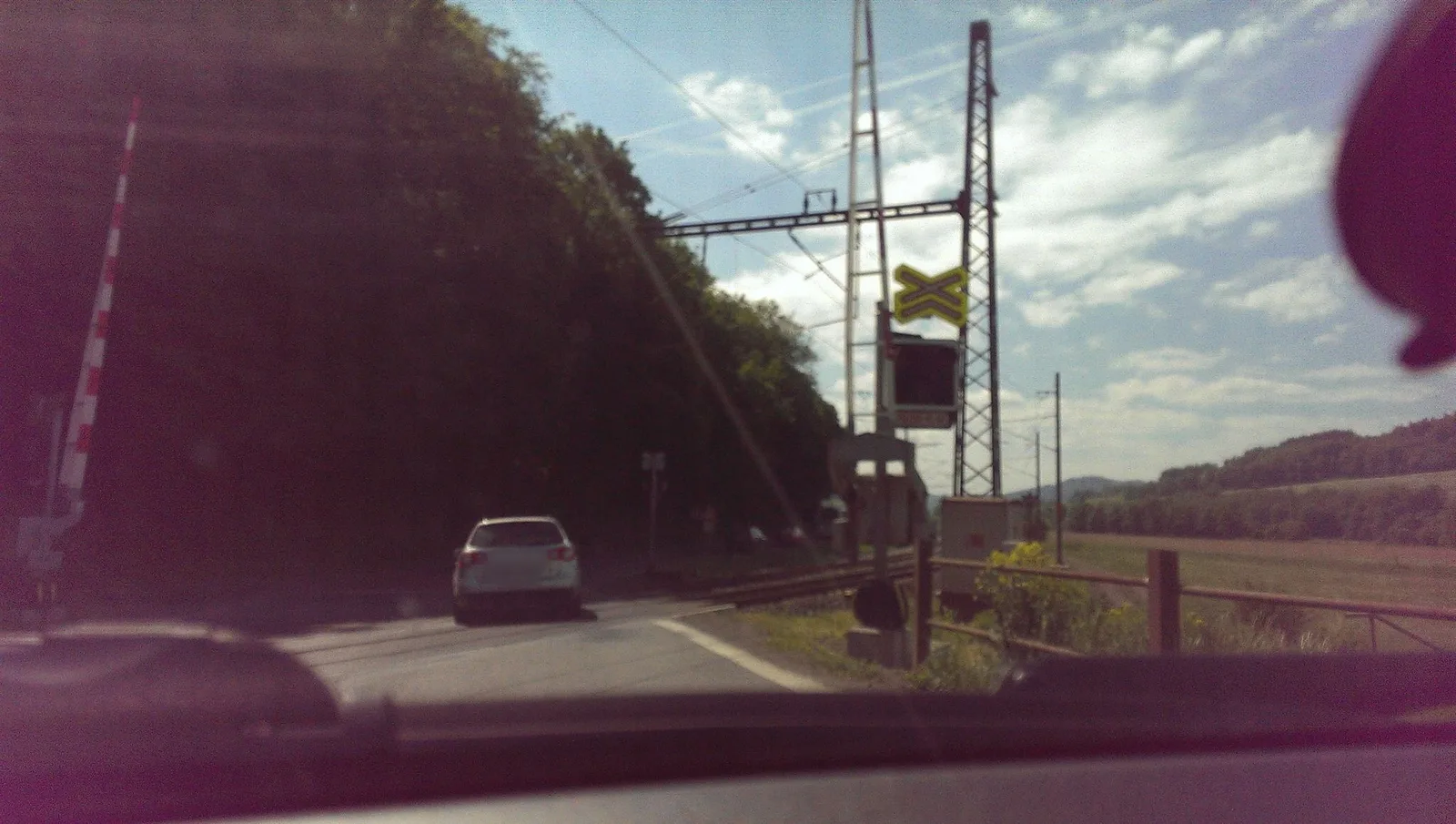 Street-level view of a level crossing in the Czech Republic
