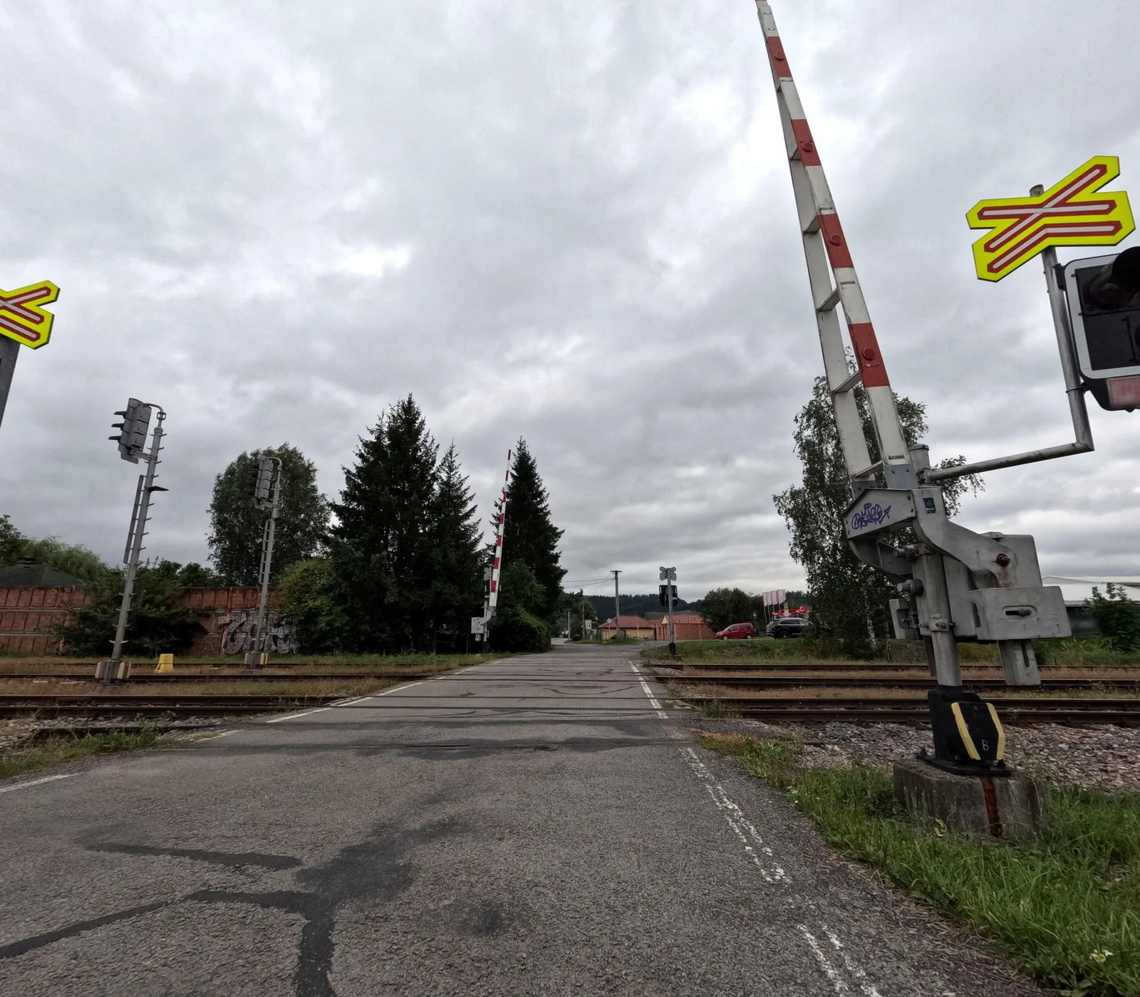 Street-level view of a level crossing in the Czech Republic