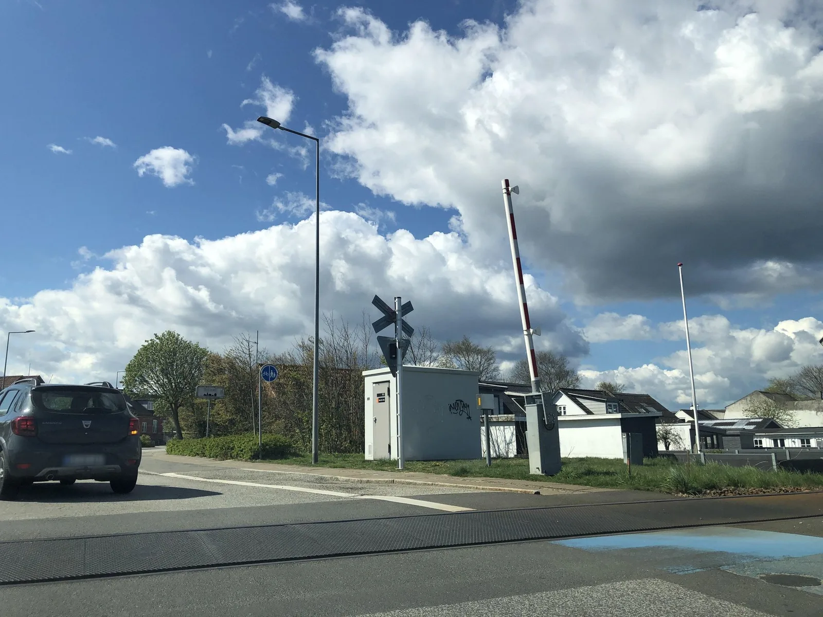 Street-level view of a level crossing in Denmark