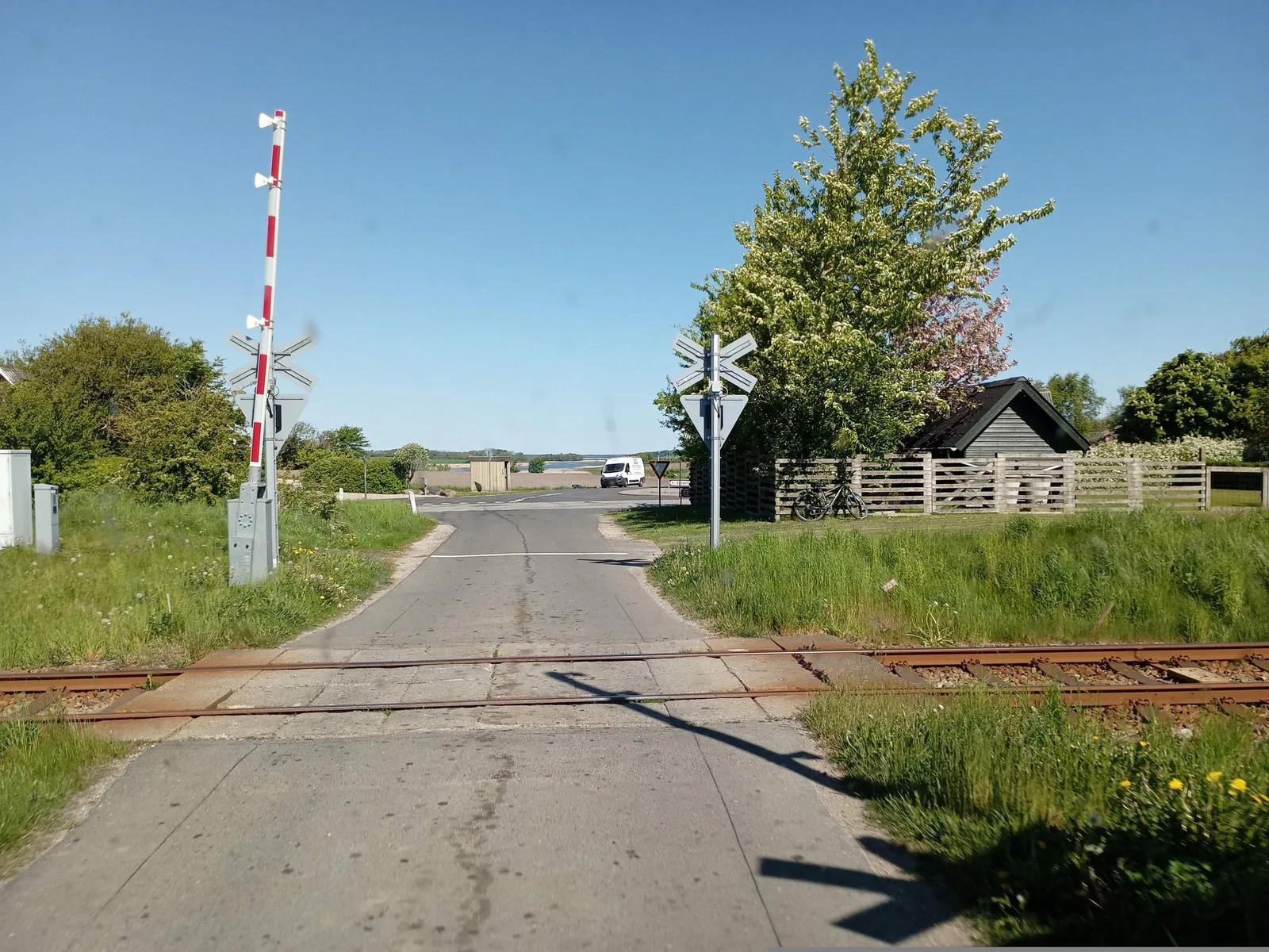 Street-level view of a level crossing in Denmark