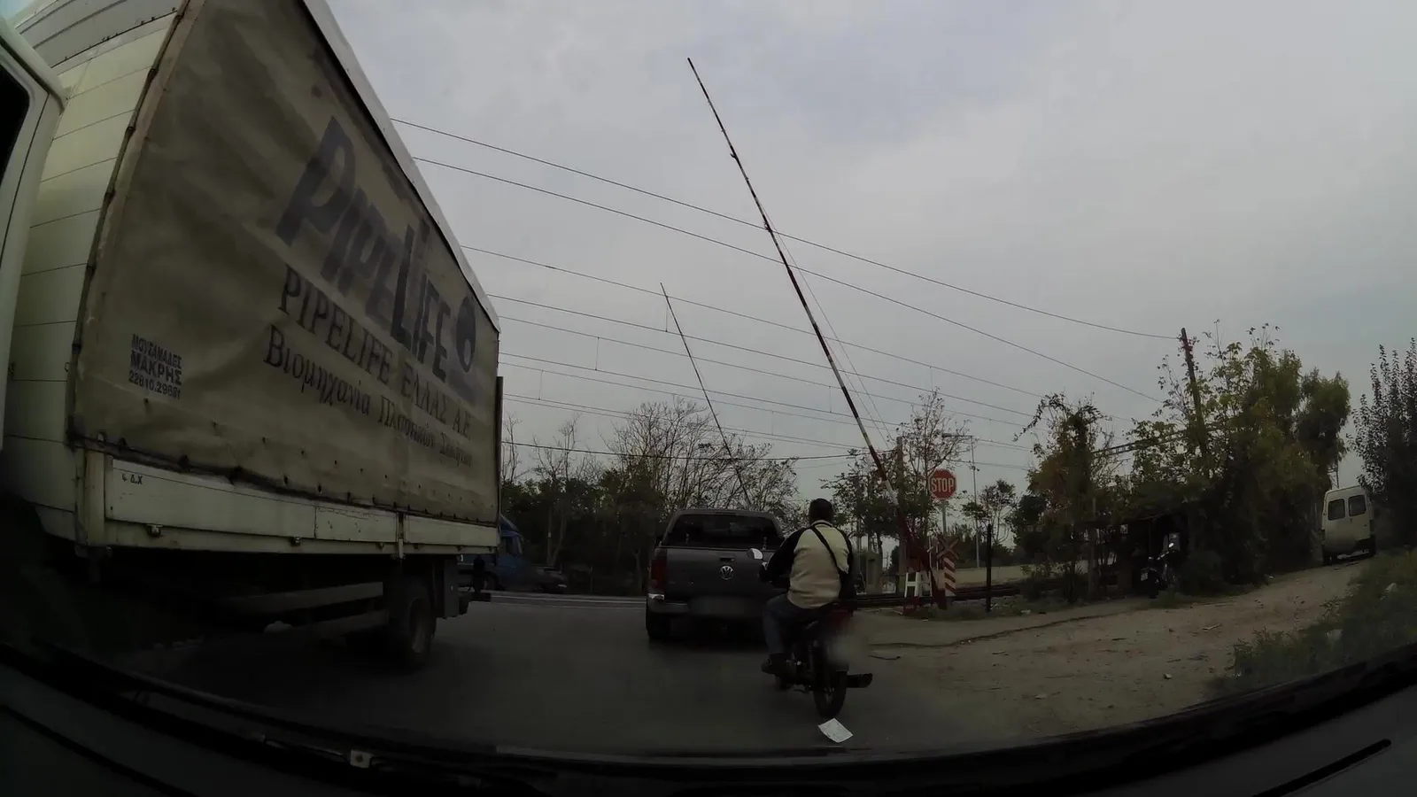 Street-level view of a level crossing in Greece