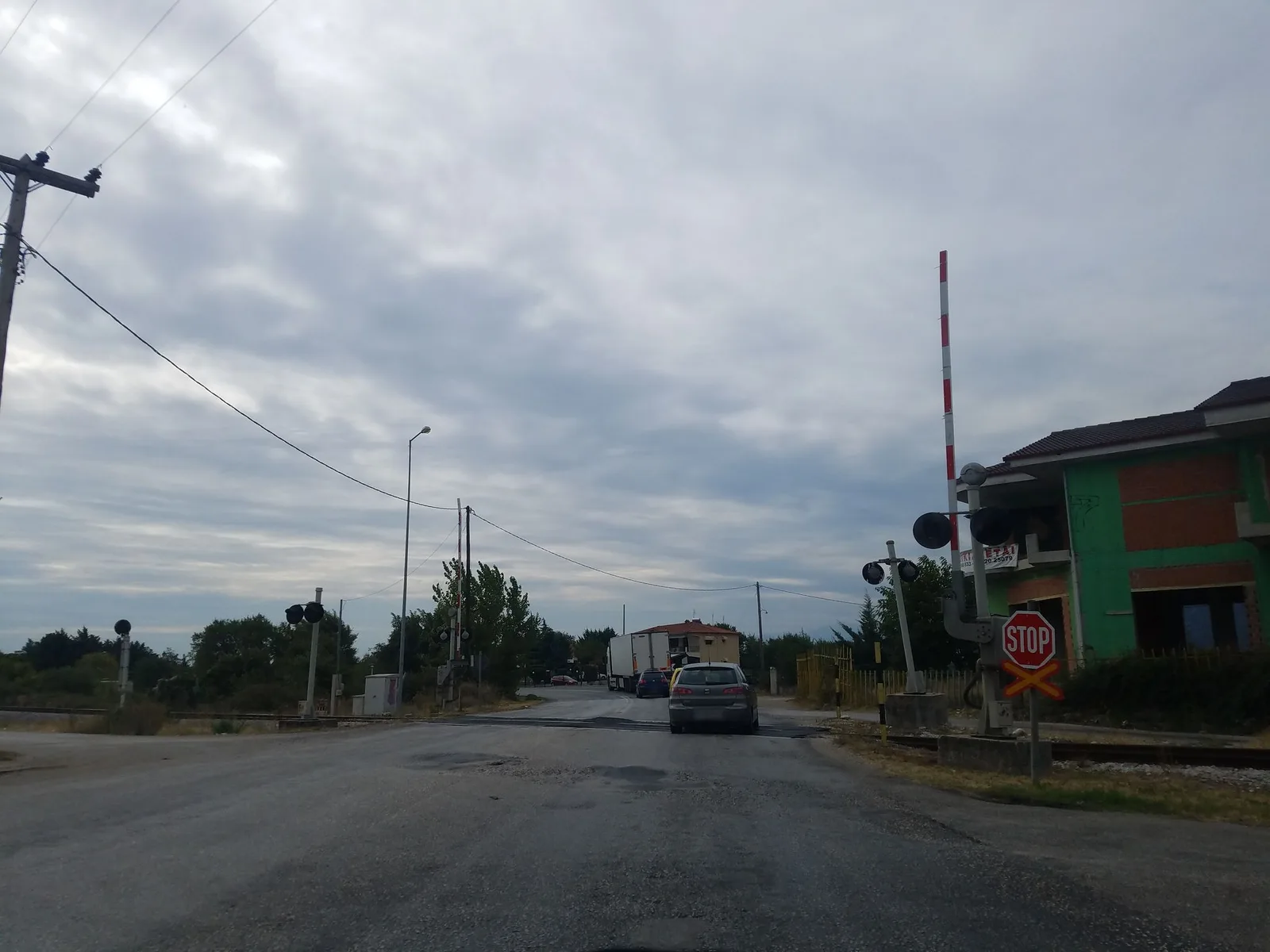 Street-level view of a level crossing in Greece