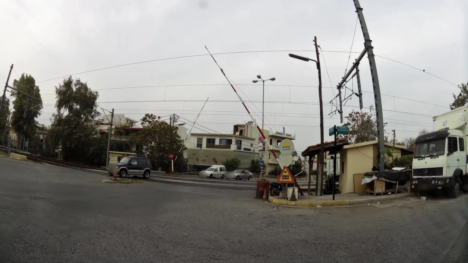 Street-level view of a level crossing in Greece