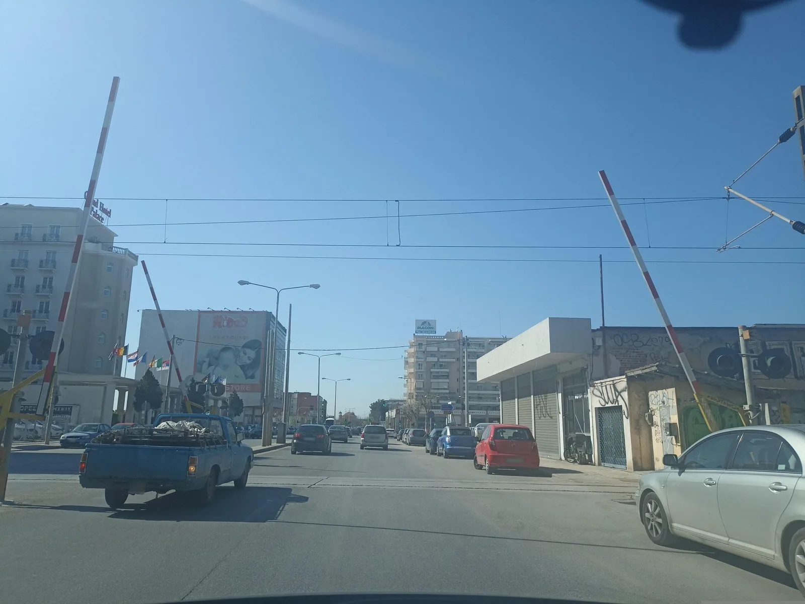 Street-level view of a level crossing in Greece