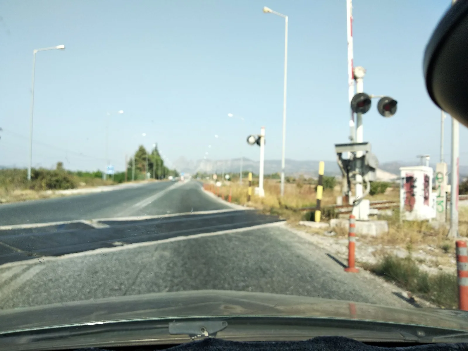 Street-level view of a level crossing in Greece