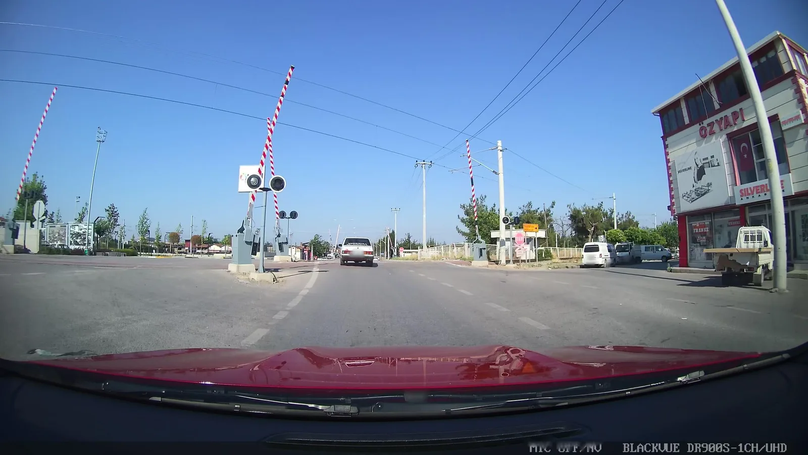 Street-level view of a level crossing in Greece
