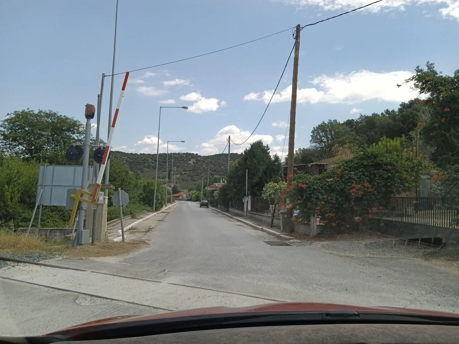 Street-level view of a level crossing in Greece