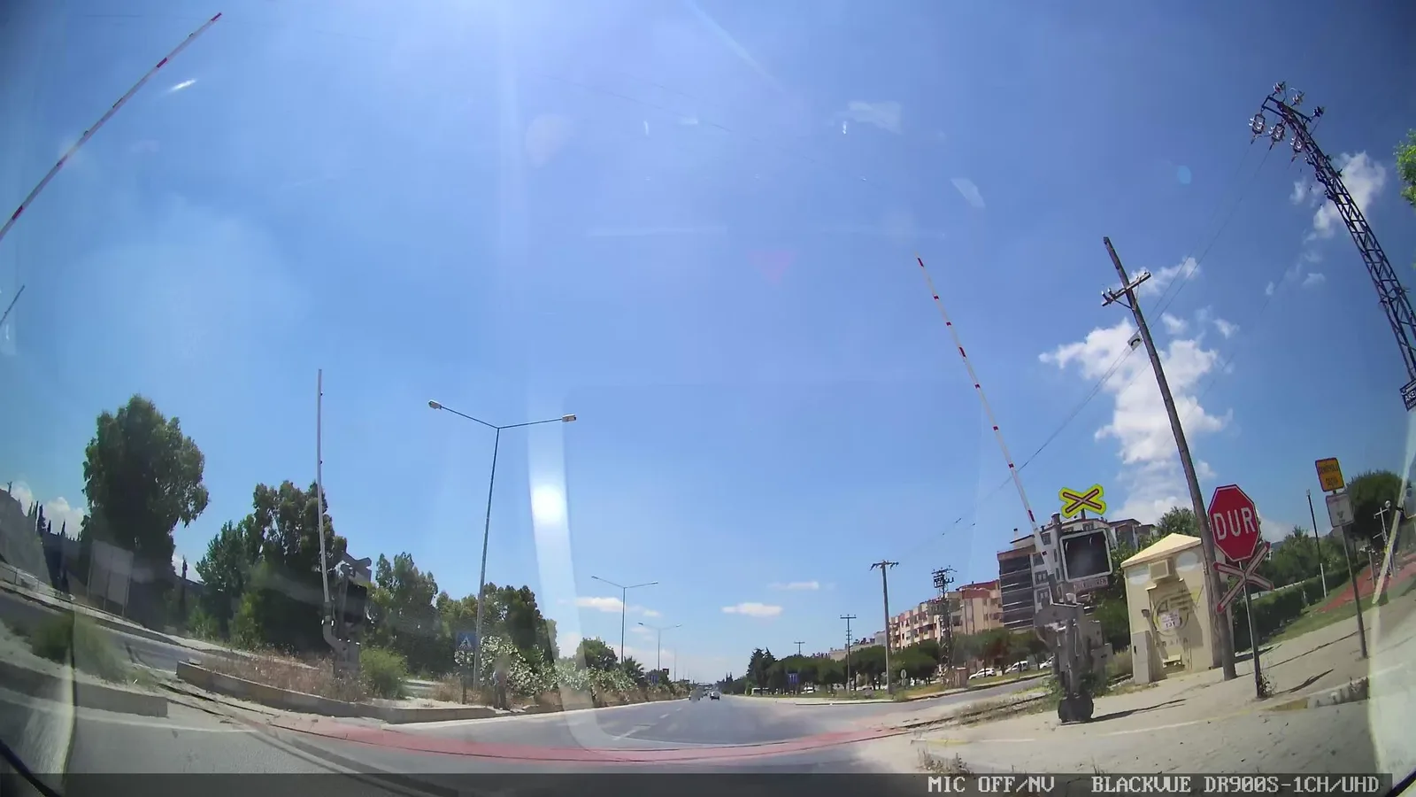 Street-level view of a level crossing in Greece