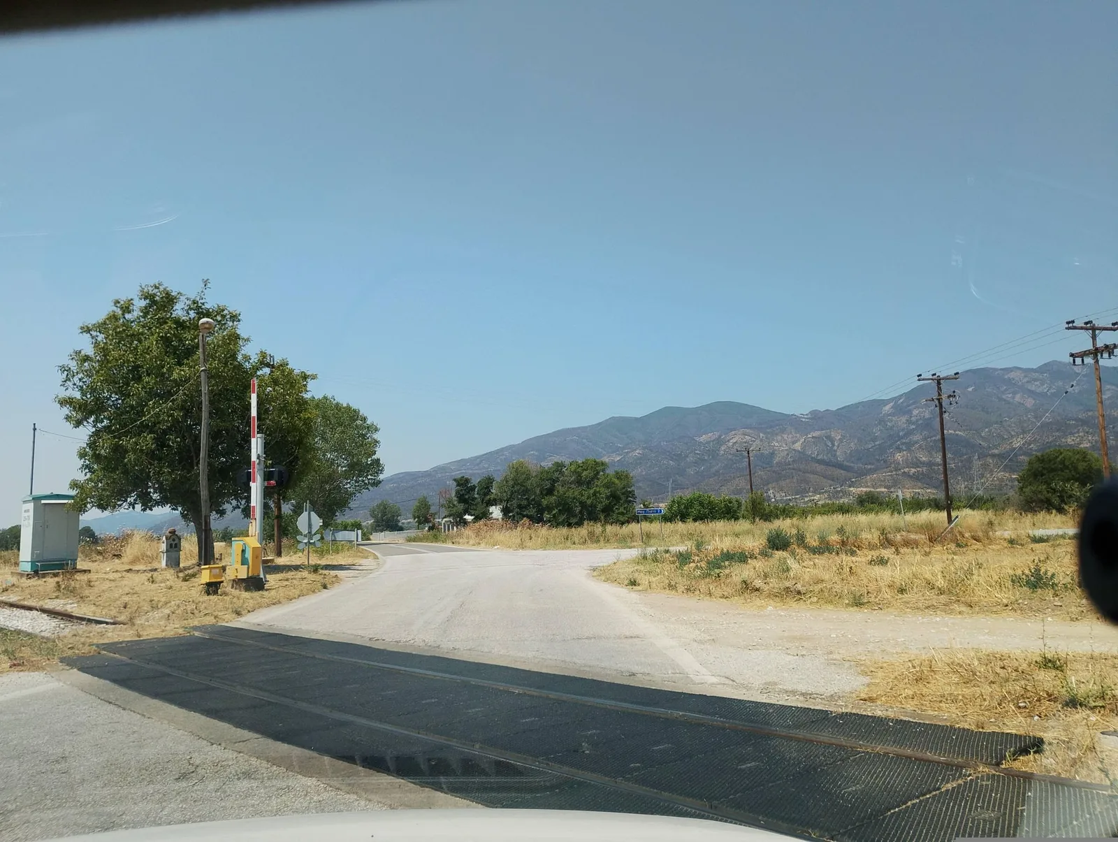 Street-level view of a level crossing in Greece
