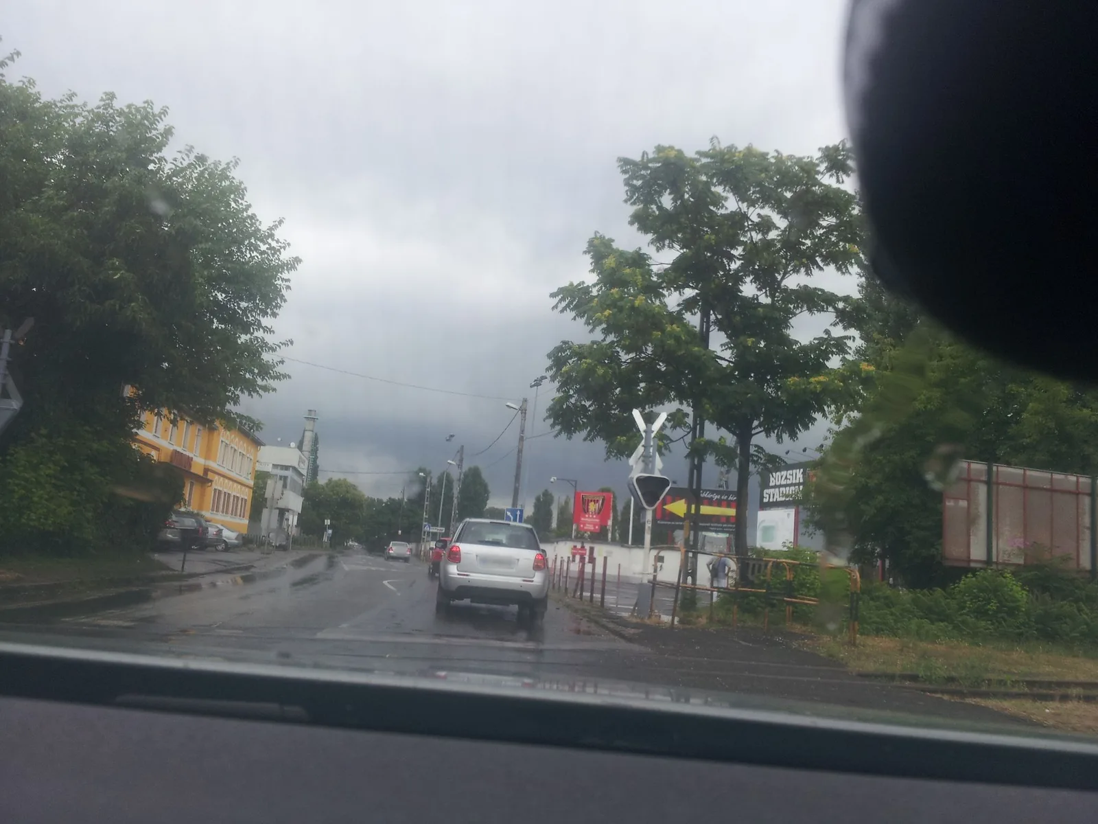 Street-level view of a level crossing in Hungary