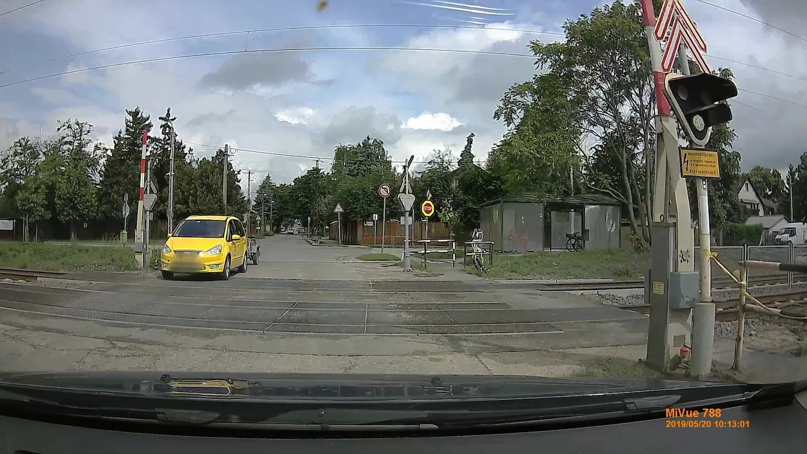 Street-level view of a level crossing in Hungary
