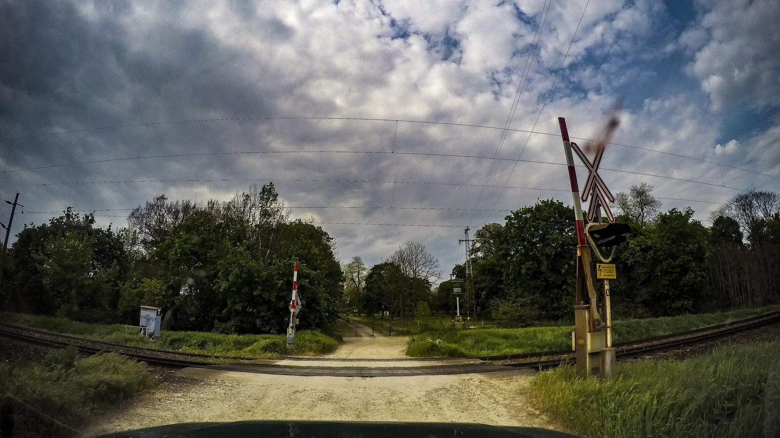 Street-level view of a level crossing in Hungary