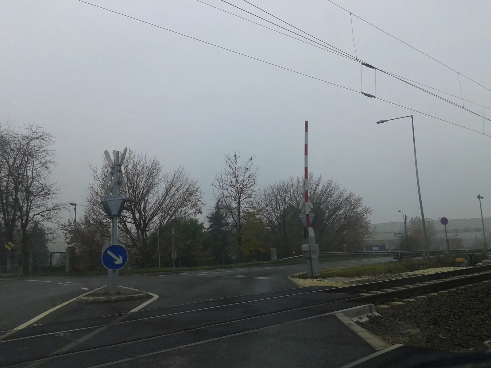 Street-level view of a level crossing in Hungary