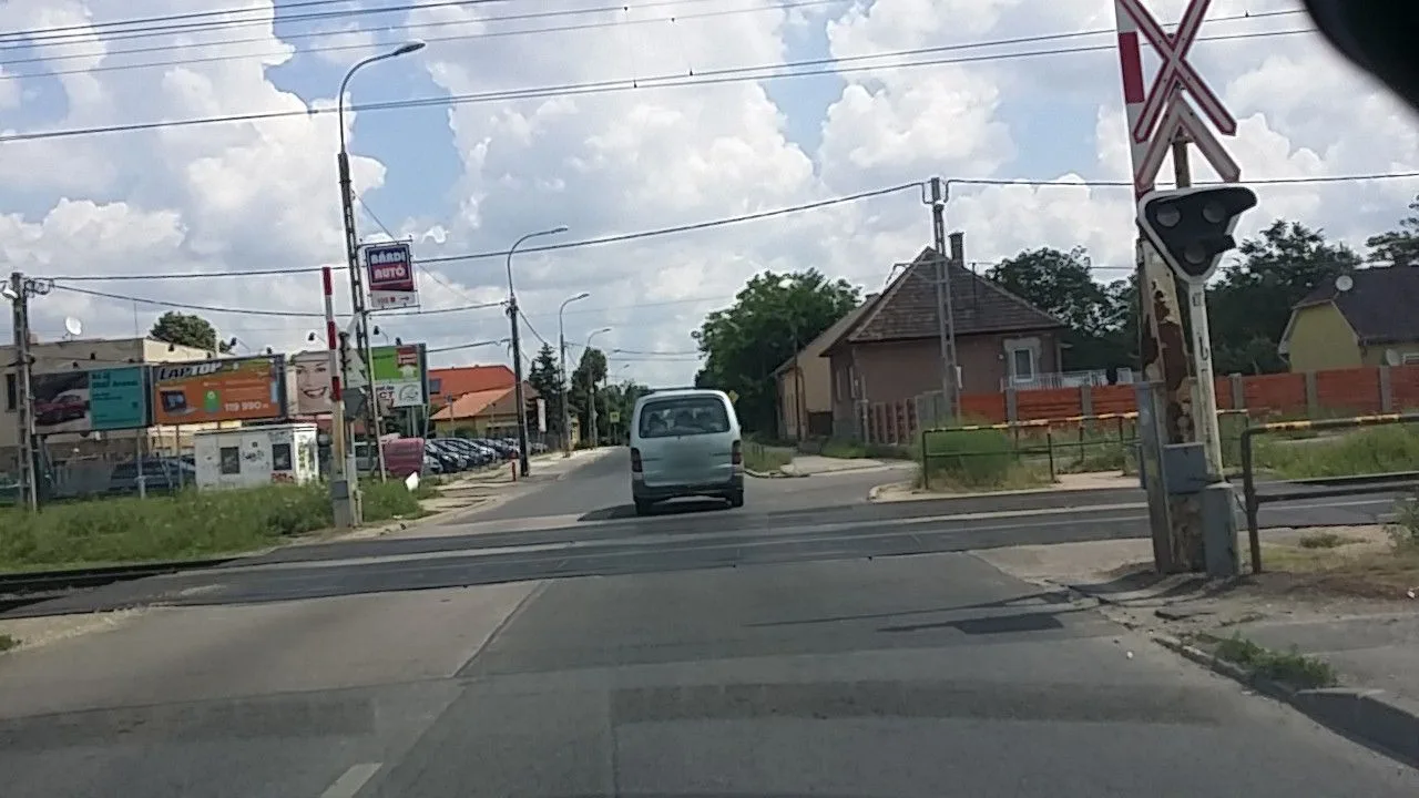 Street-level view of a level crossing in Hungary