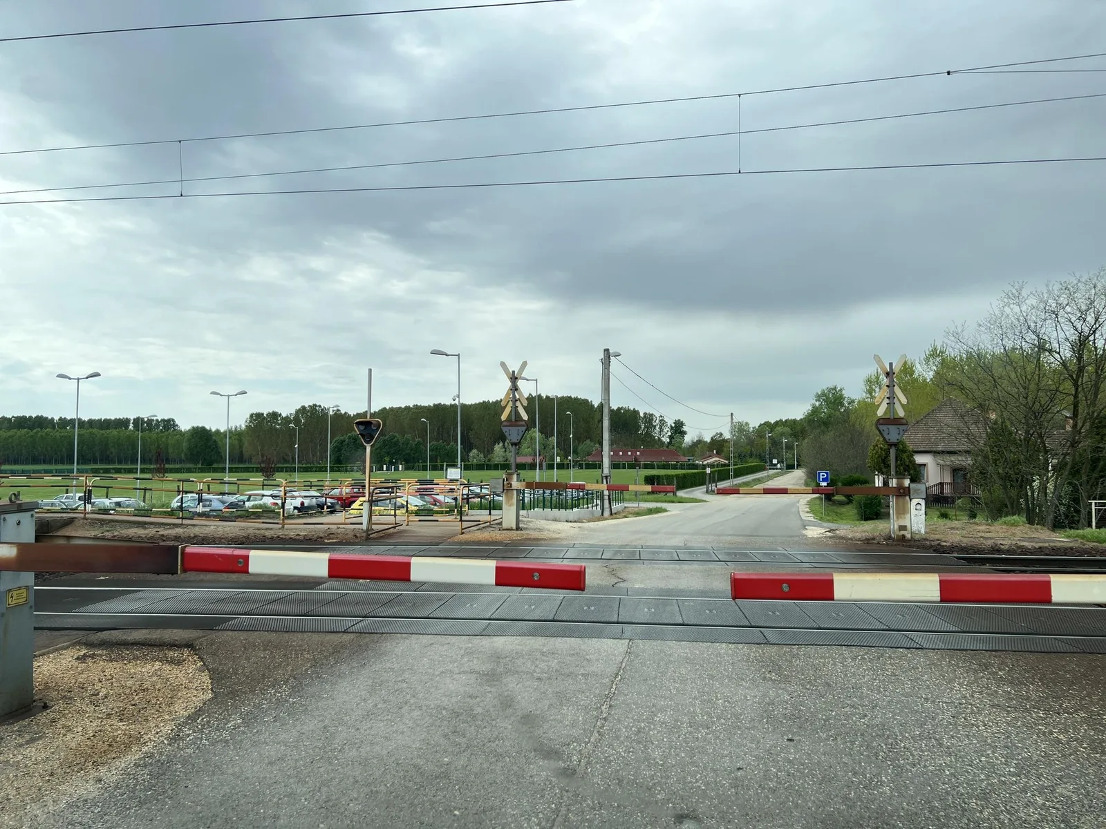 Street-level view of a level crossing in Hungary