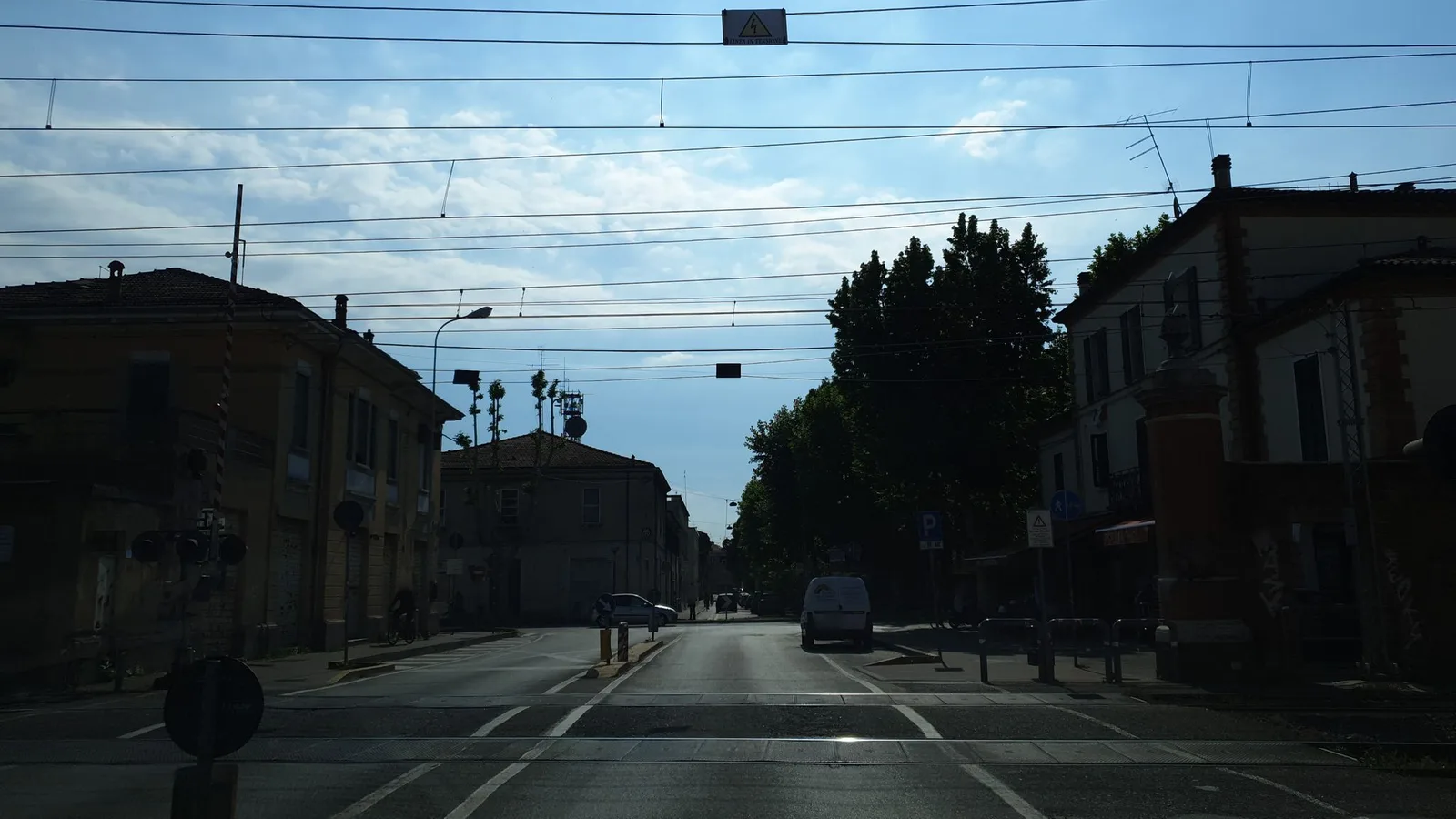 Street-level view of a level crossing in Italy