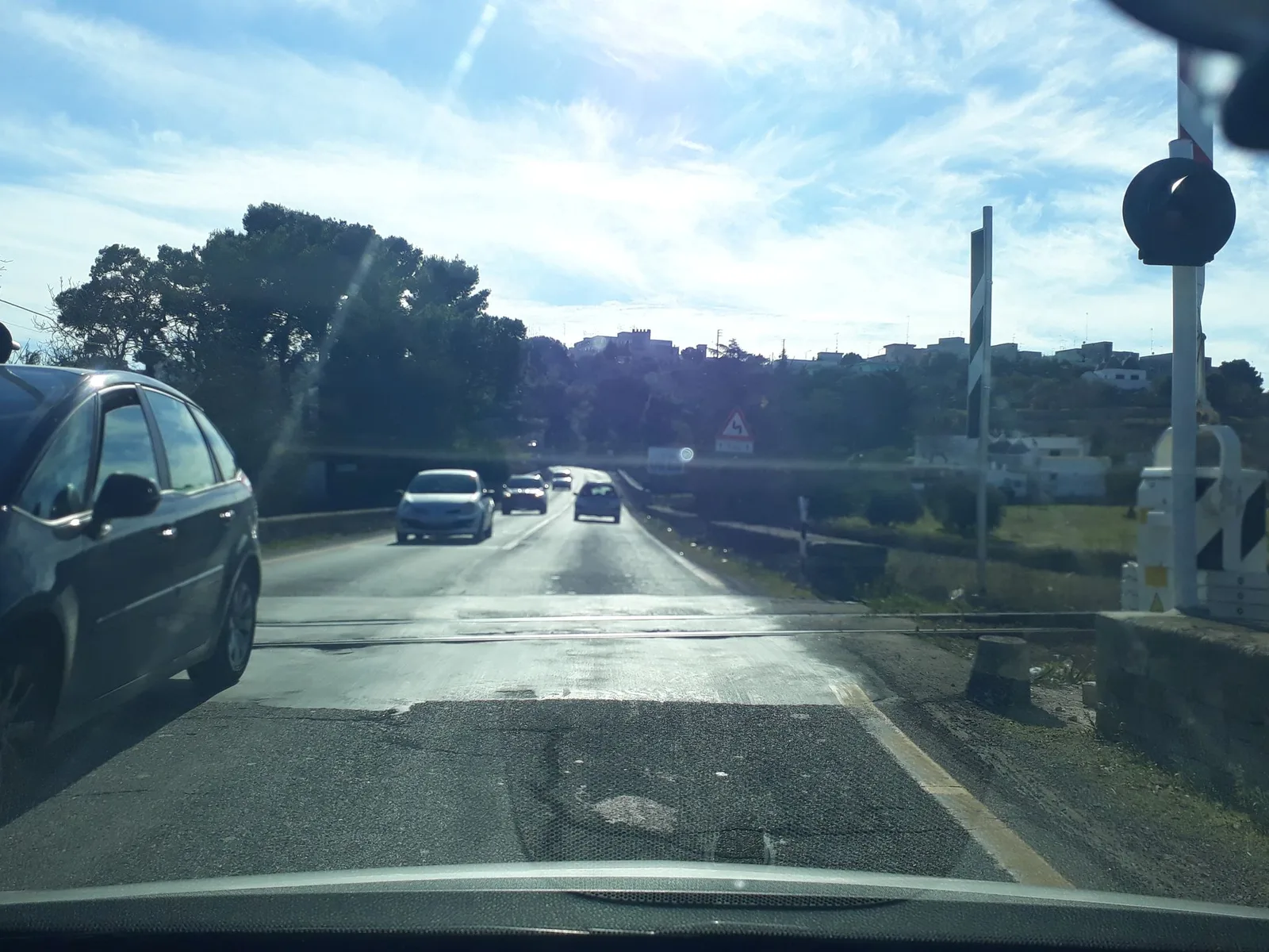 Street-level view of a level crossing in Italy
