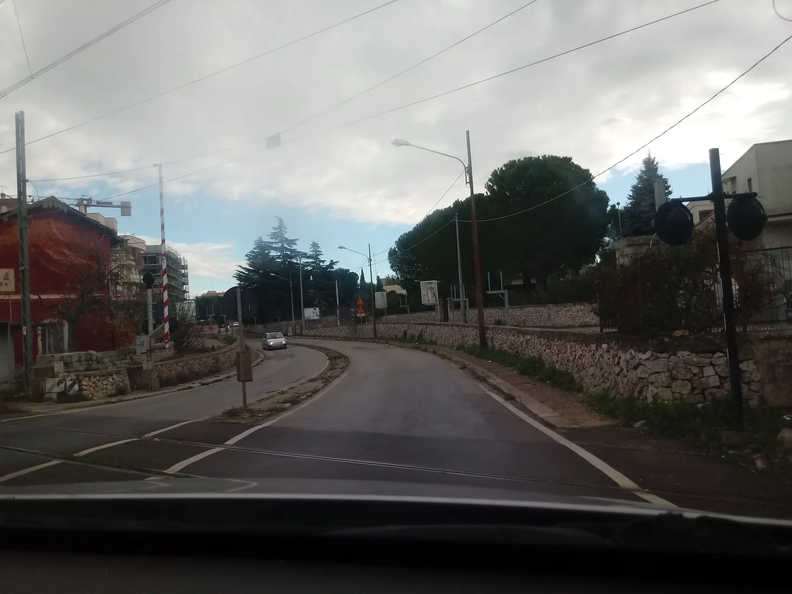Street-level view of a level crossing in Italy