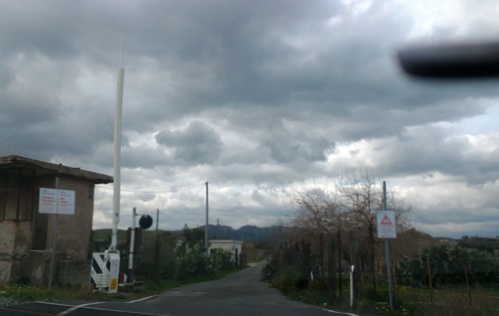 Street-level view of a level crossing in Italy