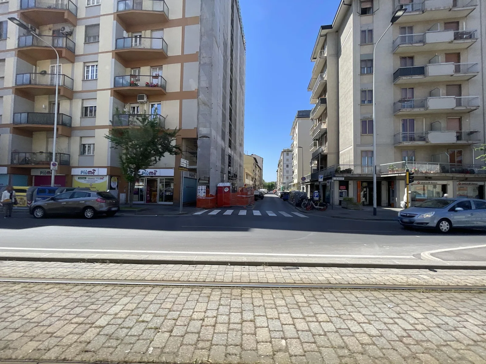 Street-level view of a level crossing in Italy