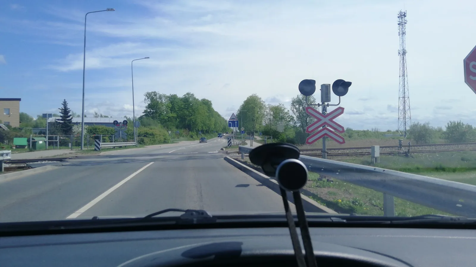 Street-level view of a level crossing in Lithuania
