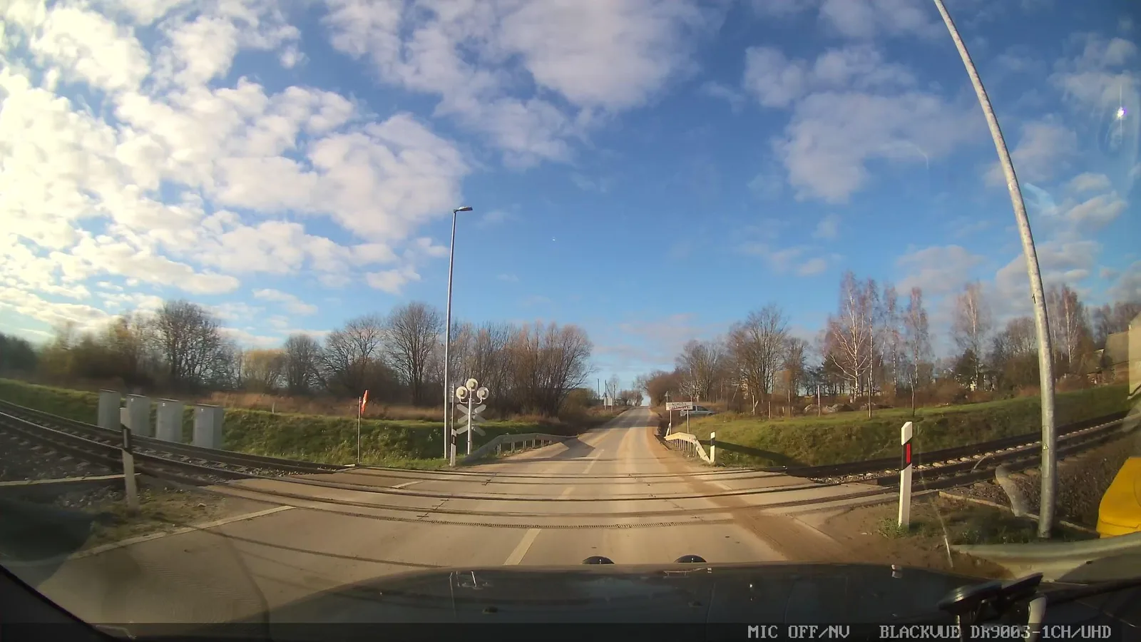 Street-level view of a level crossing in Lithuania