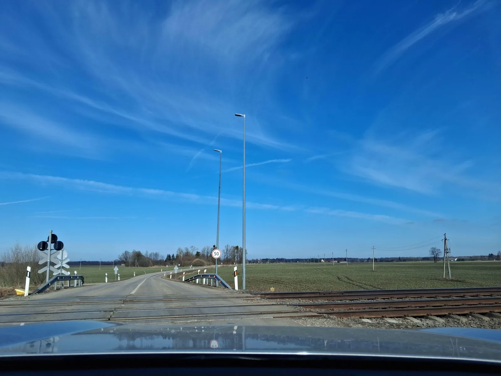 Street-level view of a level crossing in Lithuania