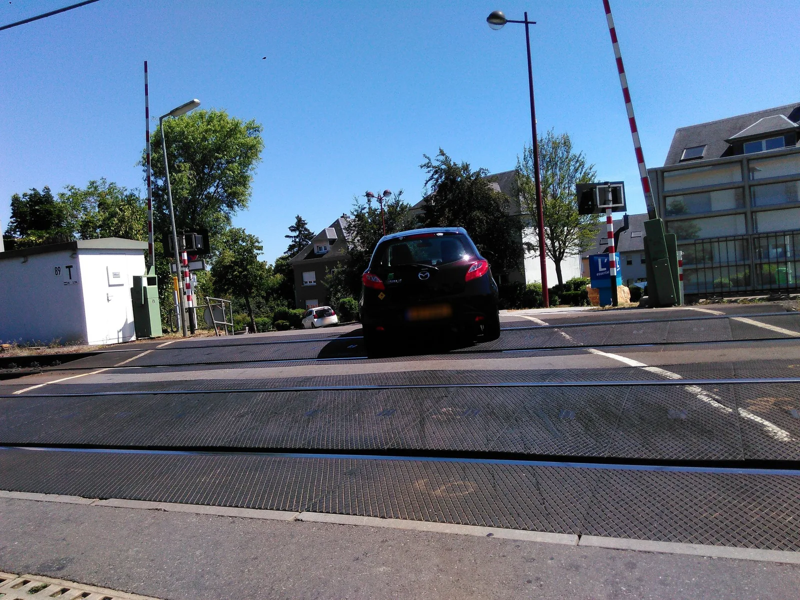 Street-level view of a level crossing in Luxembourg
