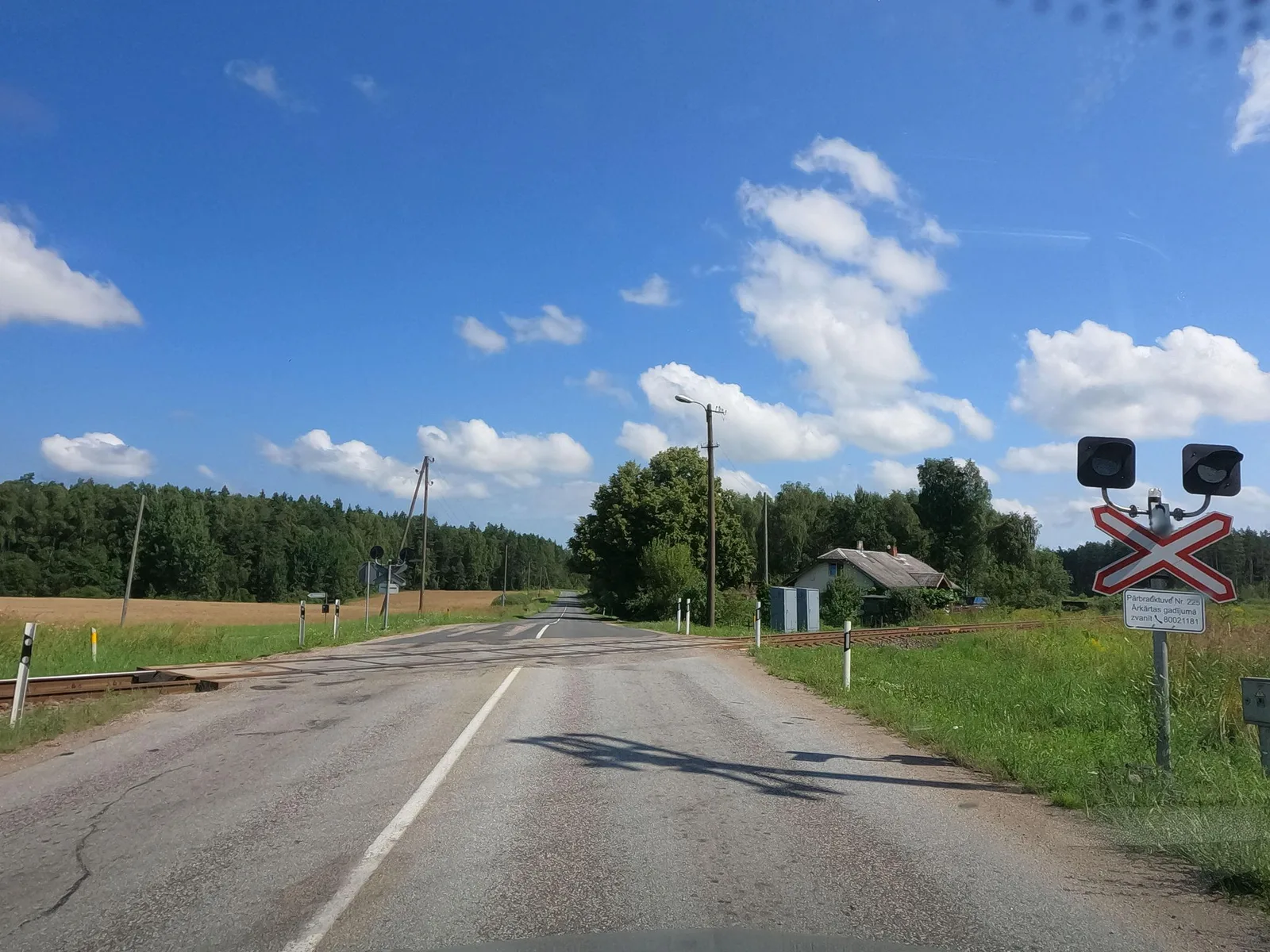 Street-level view of a level crossing in Latvia
