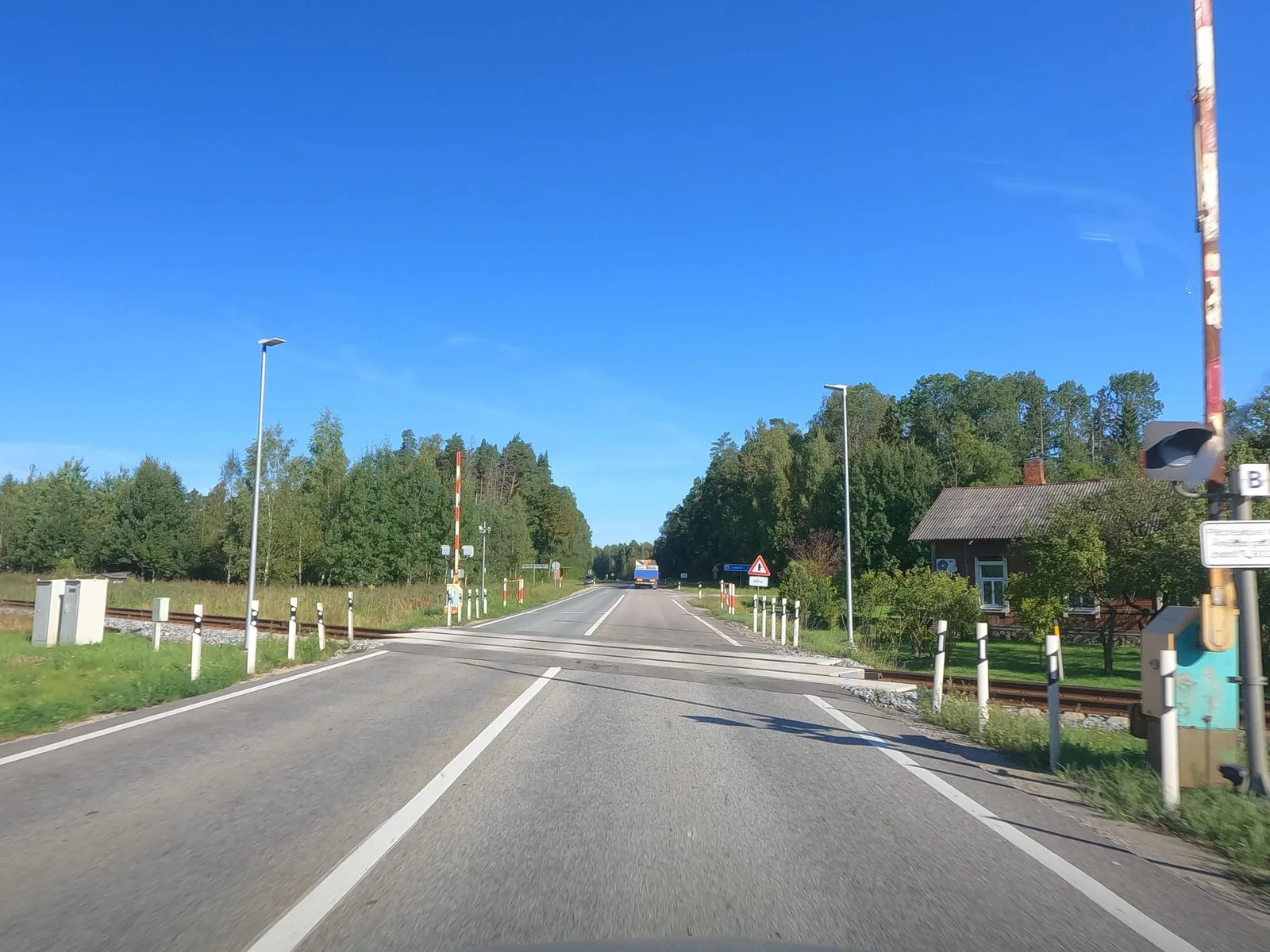Street-level view of a level crossing in Latvia