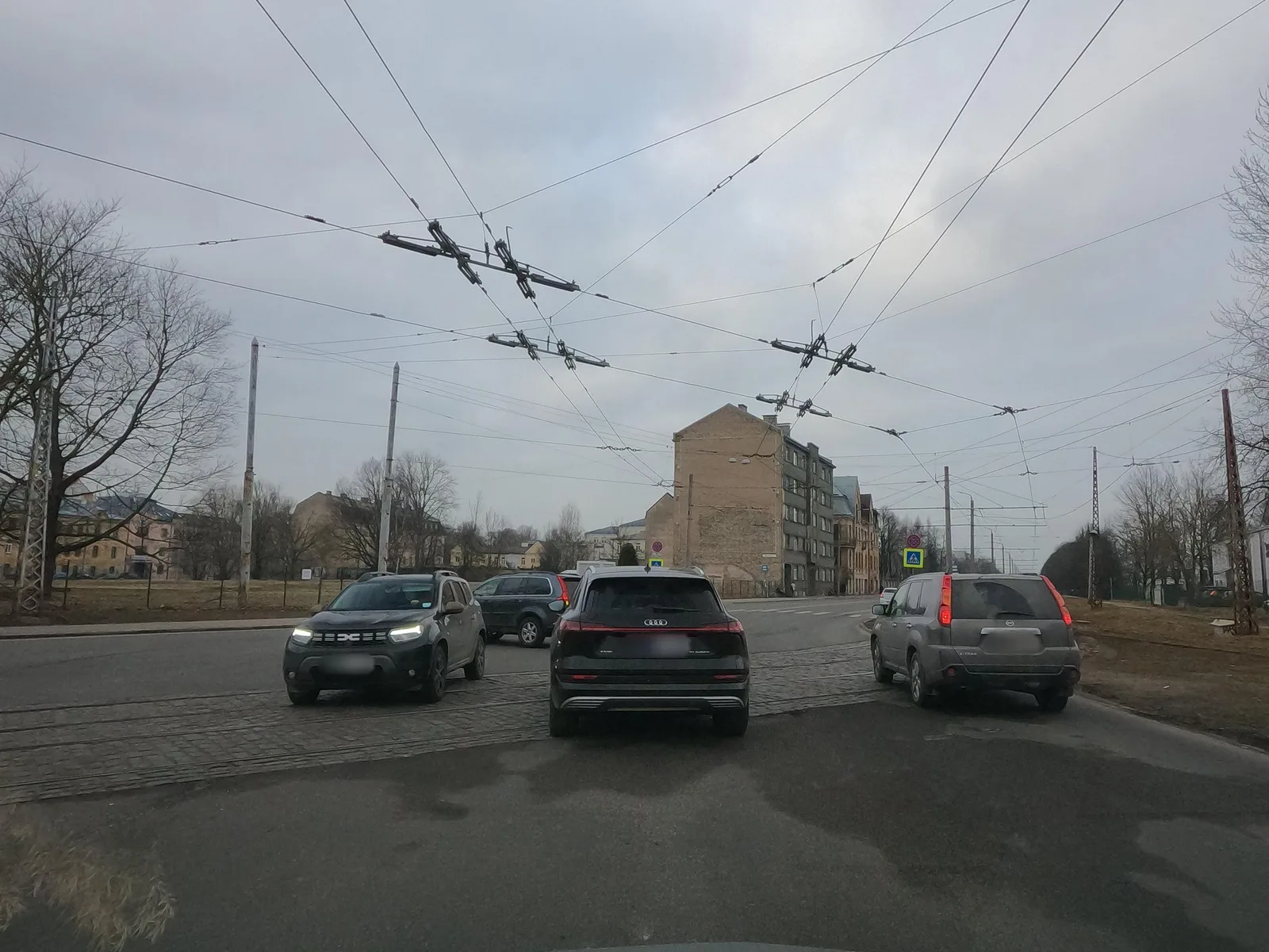 Street-level view of a level crossing in Latvia