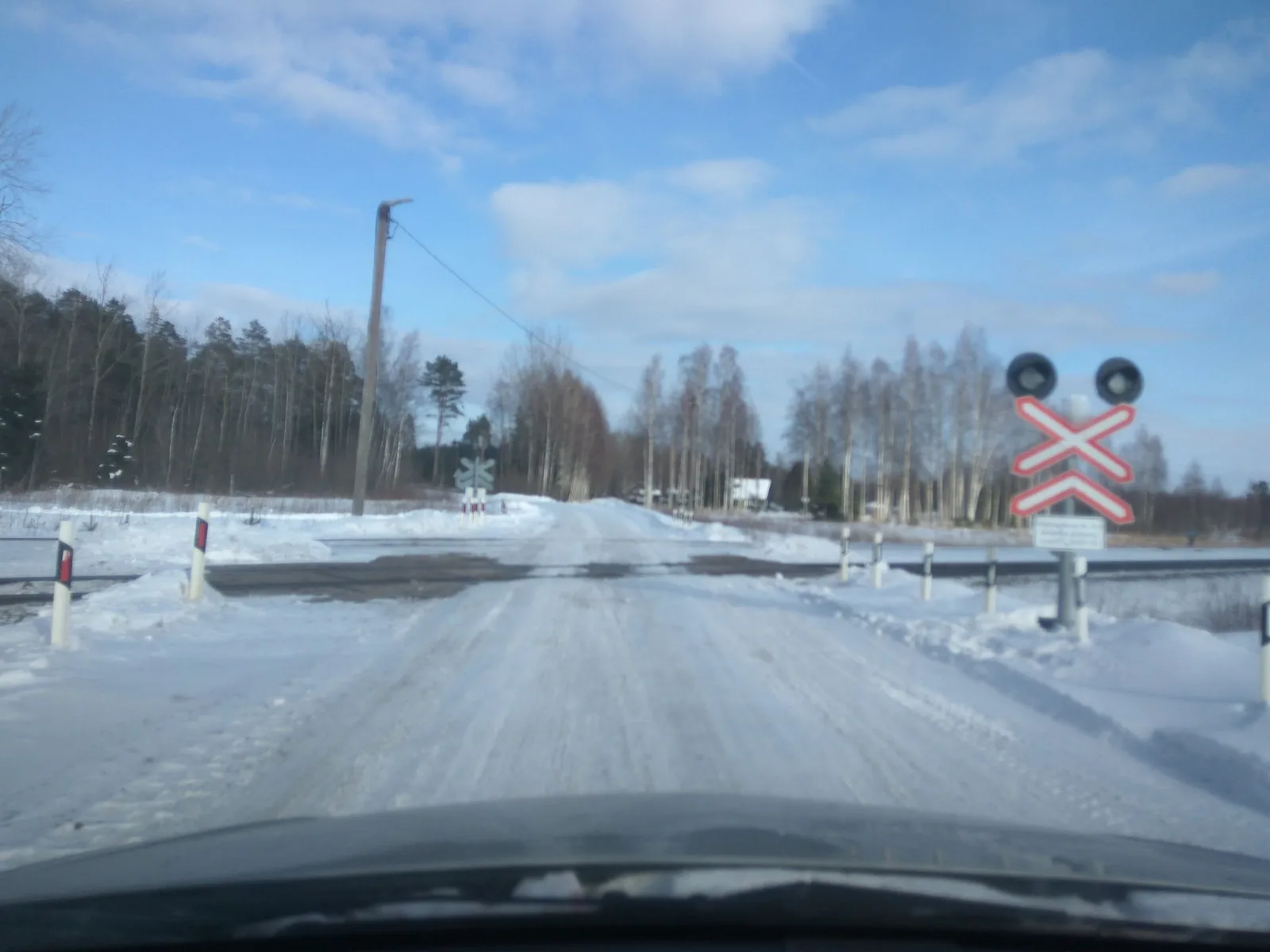 Street-level view of a level crossing in Latvia