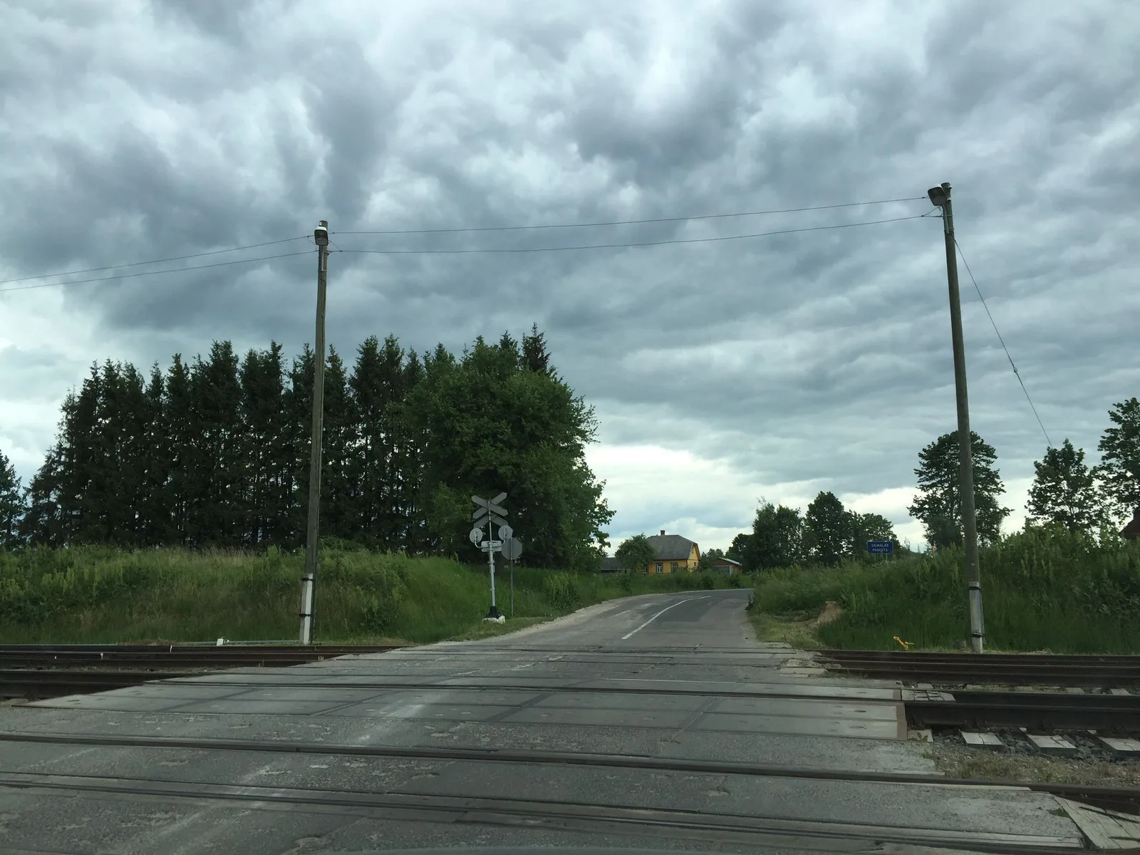 Street-level view of a level crossing in Latvia