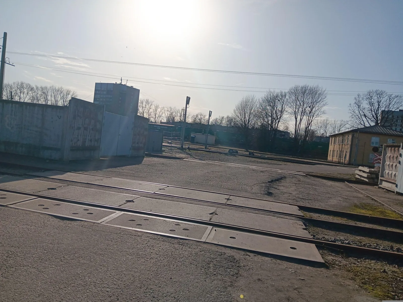 Street-level view of a level crossing in Latvia