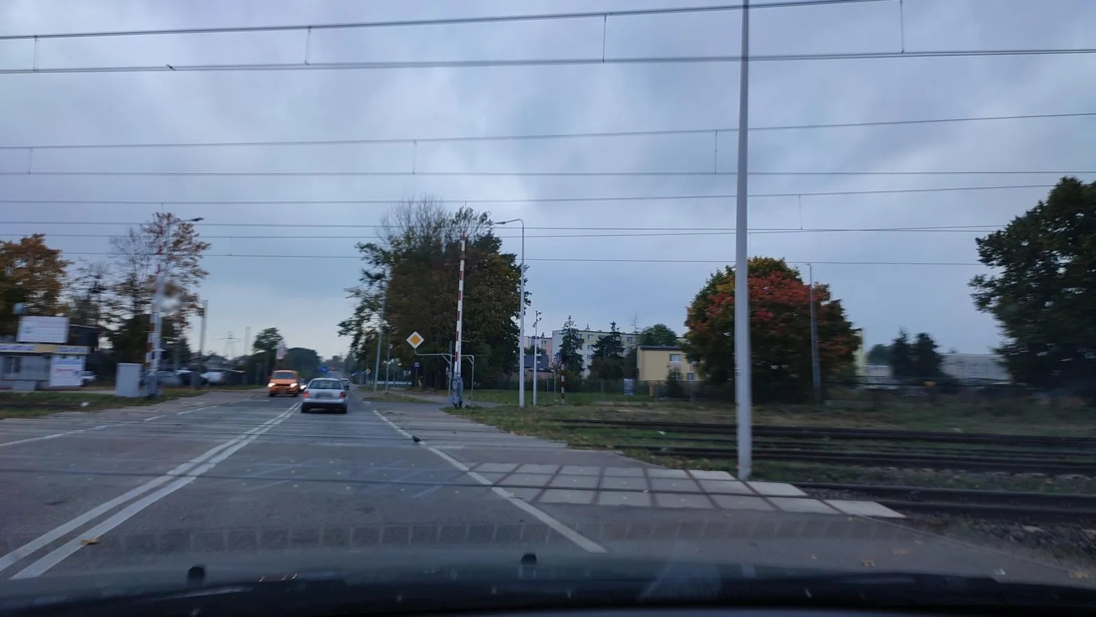 Street-level view of a level crossing in Poland