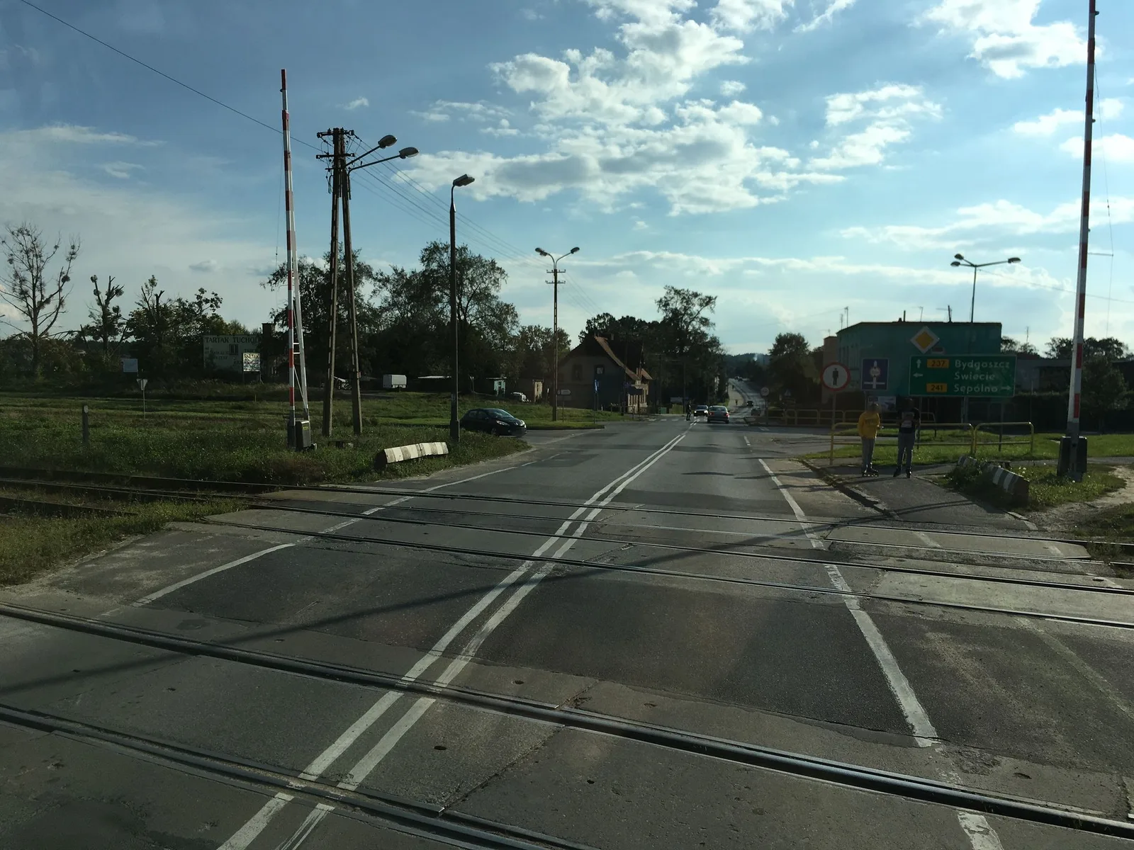 Street-level view of a level crossing in Poland