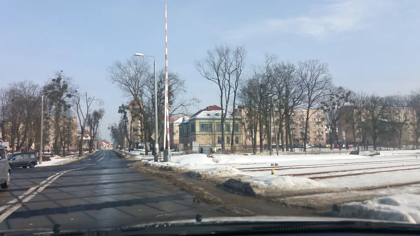 Street-level view of a level crossing in Poland