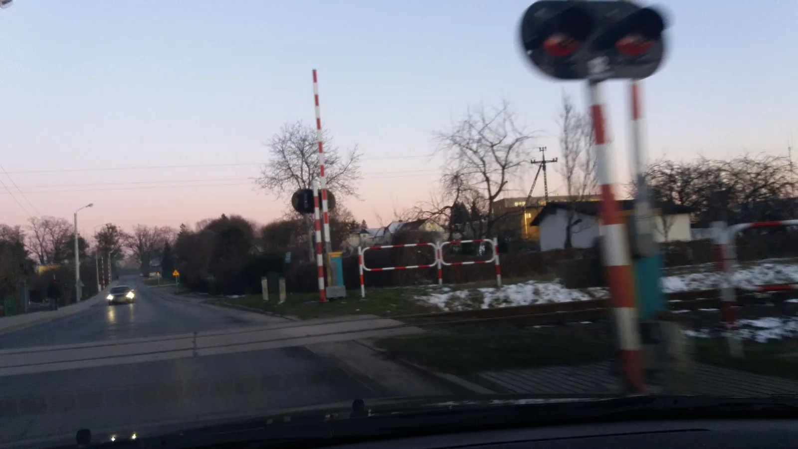 Street-level view of a level crossing in Poland