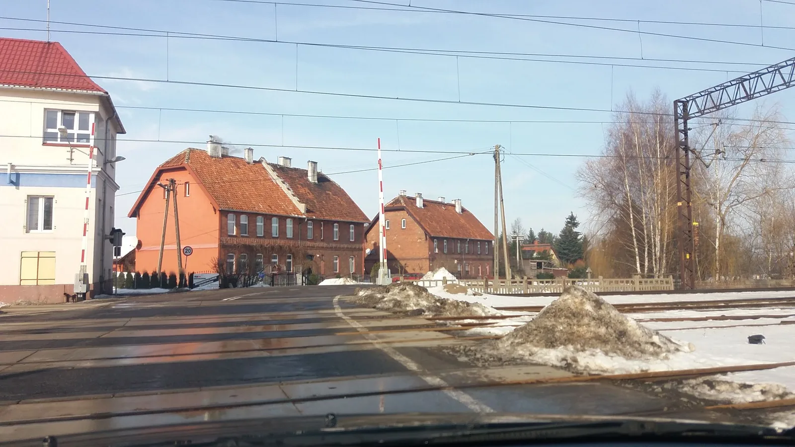Street-level view of a level crossing in Poland