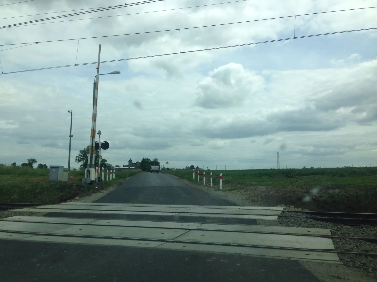 Street-level view of a level crossing in Poland