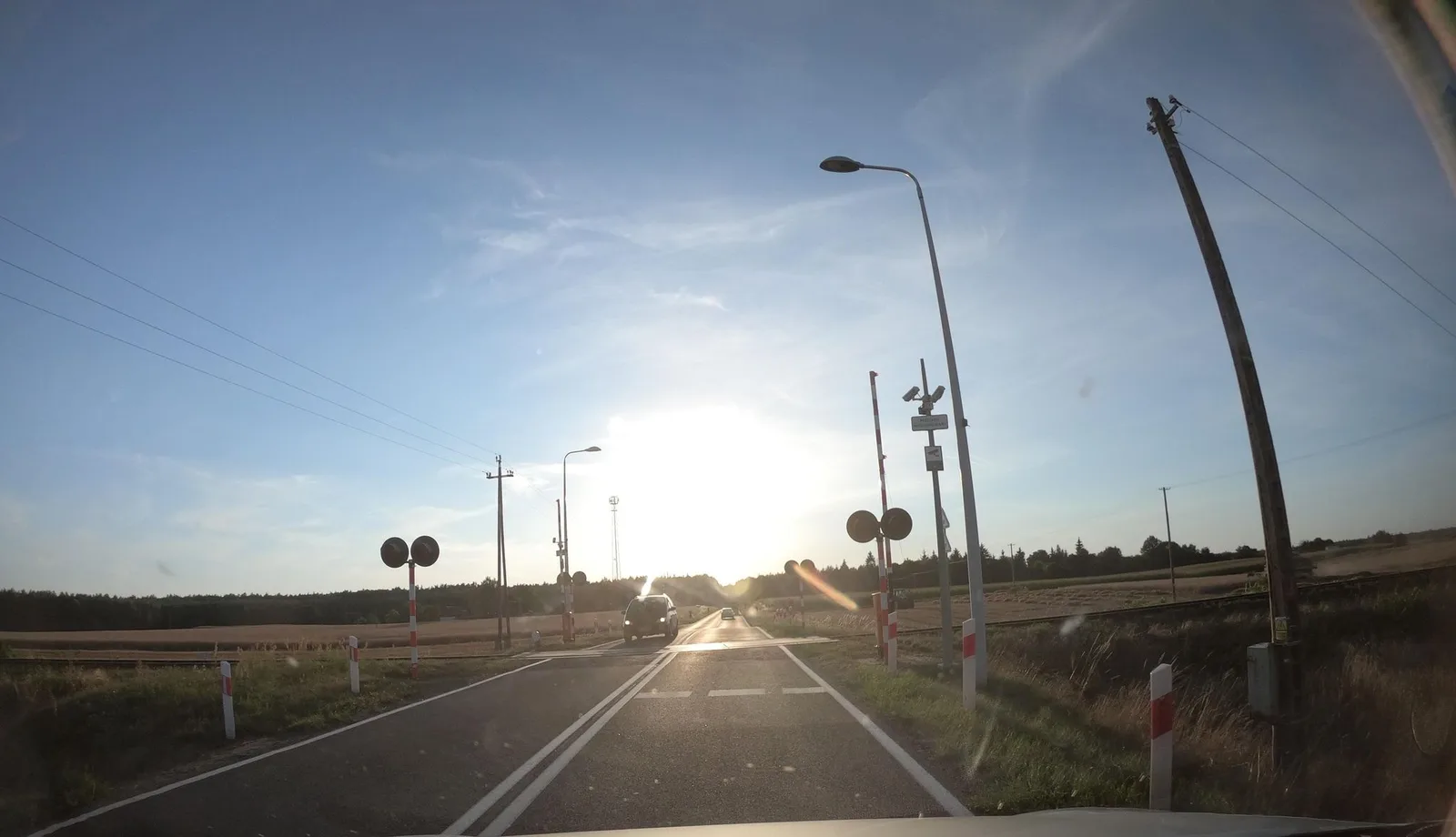 Street-level view of a level crossing in Poland